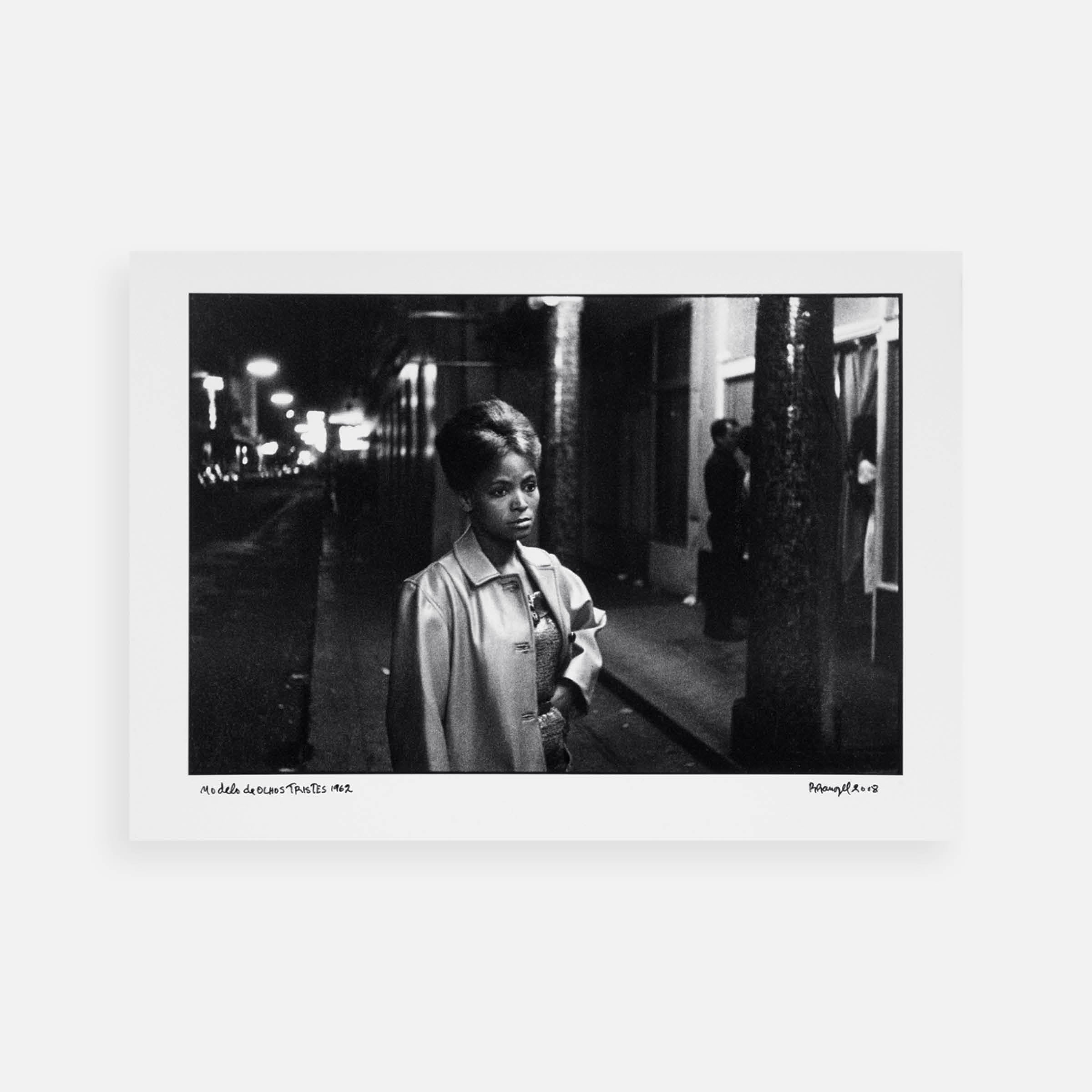 Ricardo Rangel: Sad-eyed model in this street of merry-making, 1962